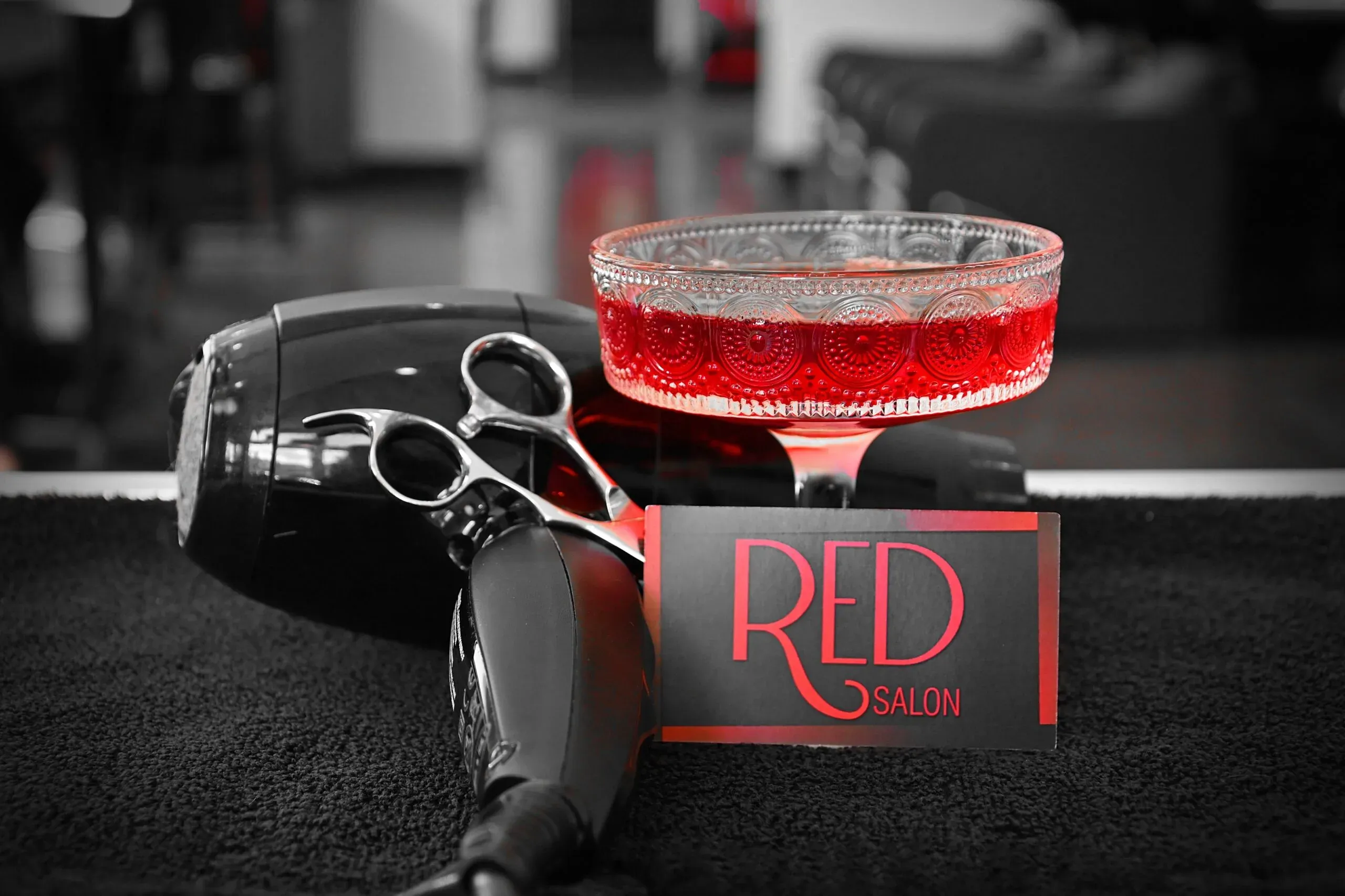 RED’s signature drink beside salon styling tools