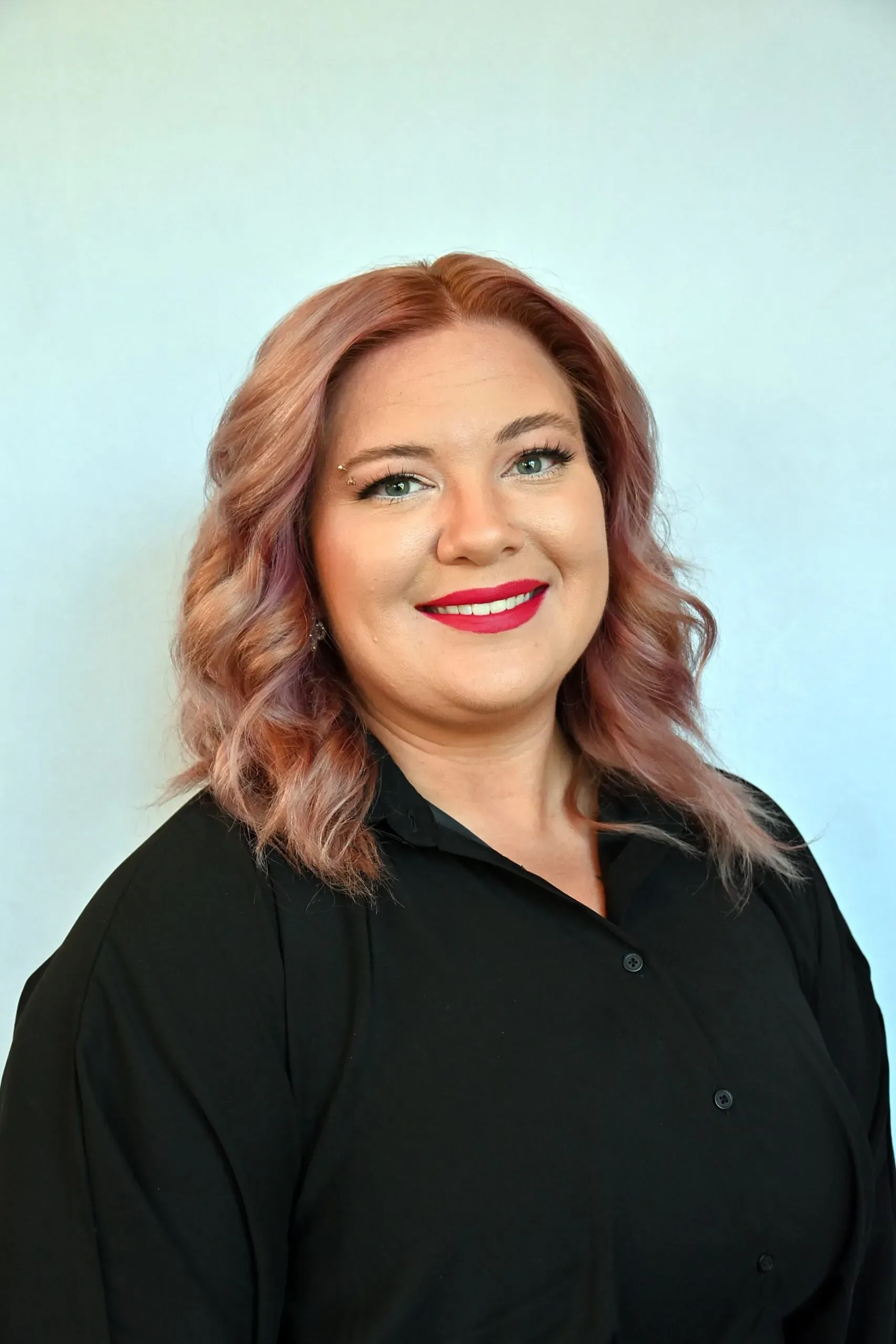 Michelle Farrow, Jr. Stylist / Esthetician, retained from an earlier RED Salon page